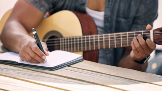 musician writing lyrics and music