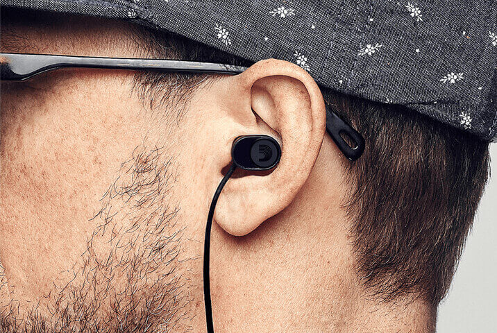man wearing D'Addario dBud Earplugs